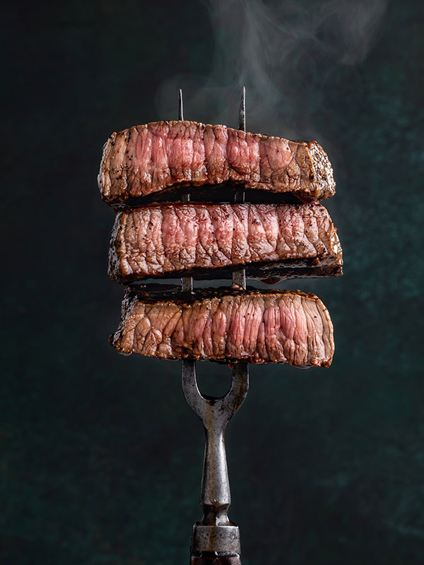 Beef slices on fork